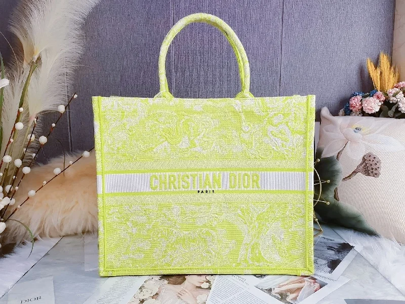 Christian Dior tote bags with a printed Dior logo on the frontChristian Dior Large Book Tote Yellow