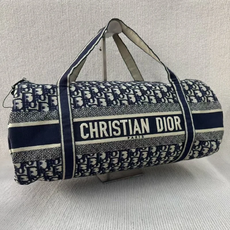 Christian Dior bags with a side - pocket for holding a water bottleChristian Dior Blue Canvas Cylinder Logo Shoulder Bag