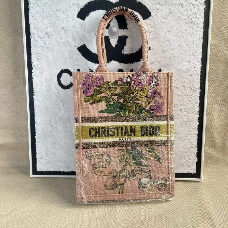 Christian Dior tote bags with a printed Dior logo on the frontChristian Dior Pink Embroidered Small Book Tote Bag